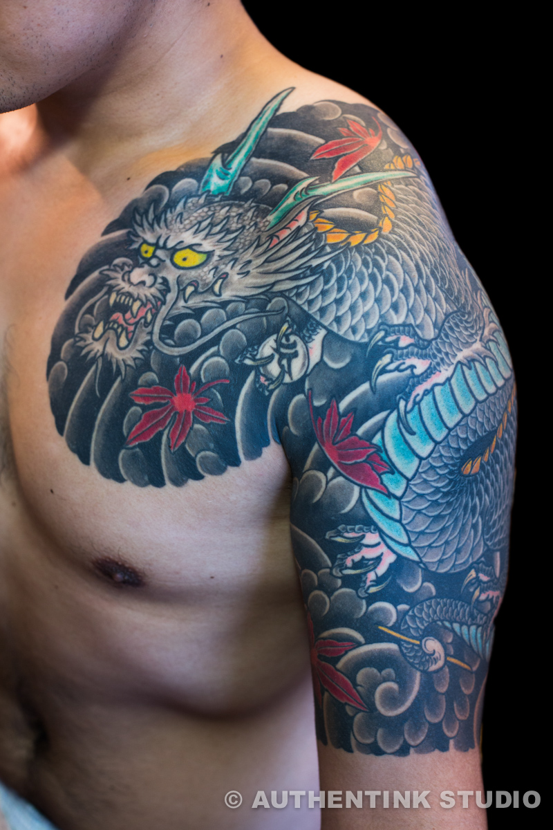 Premium Photo | A neotraditional tattoo concept of a water dragon with  flower for chinese new year
